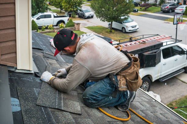 Professional Roofing technician working in Vails Gate, NY